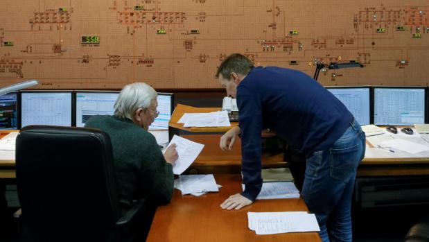 Dispatchers work in the control room of Ukraine's National power company Ukrenergo, in Kiev. Ukraine has been hit ...